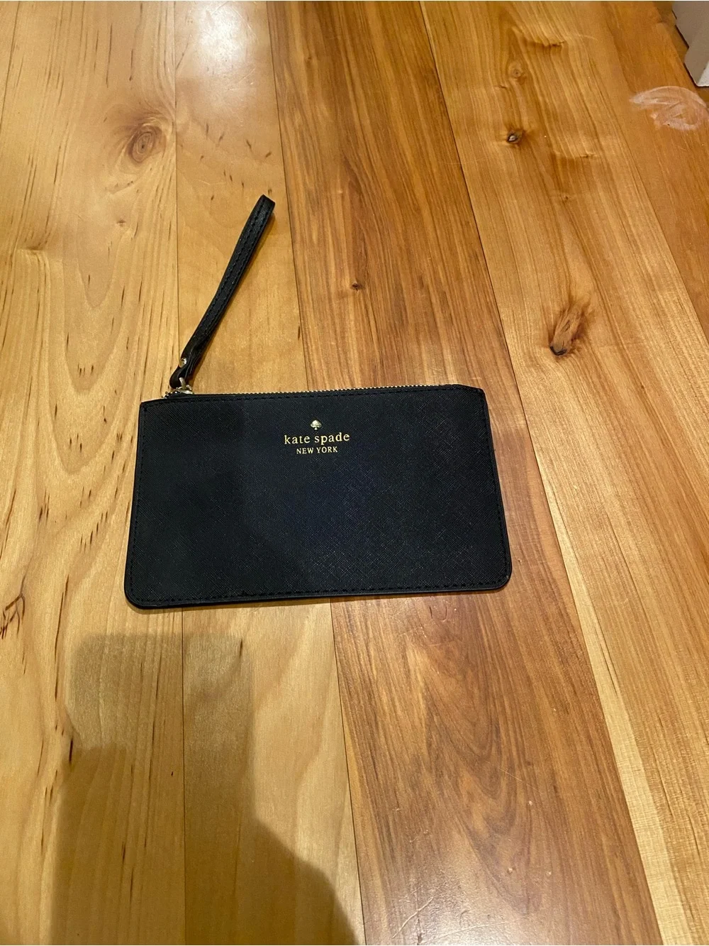 kate spade Black Pebbled Leather Lucy Wristlet with Gold Logo